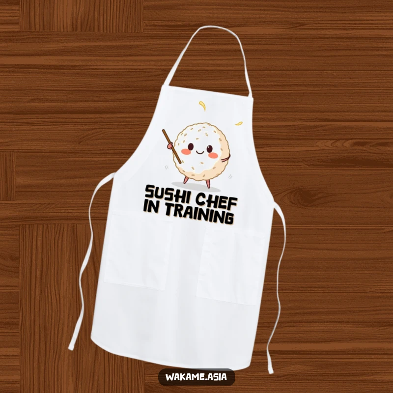 Funny apron with a smiling anthropomorphic rice ball juggling chopsticks, a humorous and practical kitchen accessory for aspiring chefs.